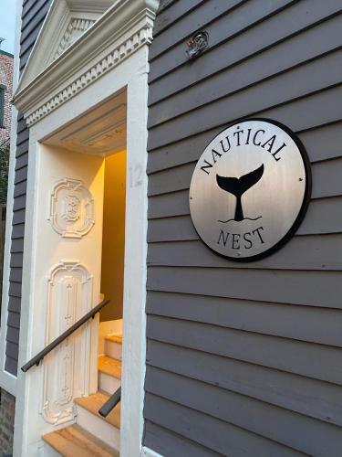 a sign on the side of a house at Nautical Nest Hudson in Hudson