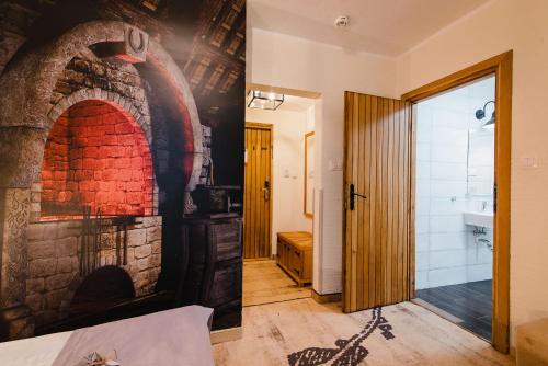 Postel nebo postele na pokoji v ubytování Hotel Podklasztorze