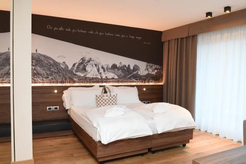 Cama o camas de una habitación en Dolomeet Boutique Hotel