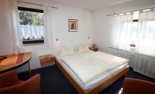 Postel nebo postele na pokoji v ubytování Gasthaus Sindel-Buckel