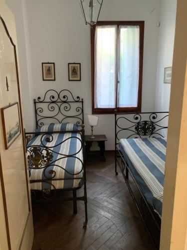 Postel nebo postele na pokoji v ubytování Dimora Castiglioni