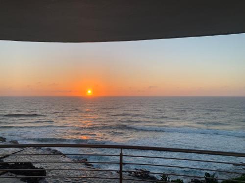 a sunset from the balcony of a cruise ship at Chakas Cove in Ballito