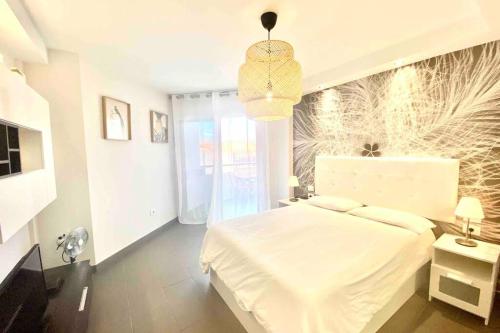 Giường trong phòng chung tại Vacation Home Studio Los Cristianos