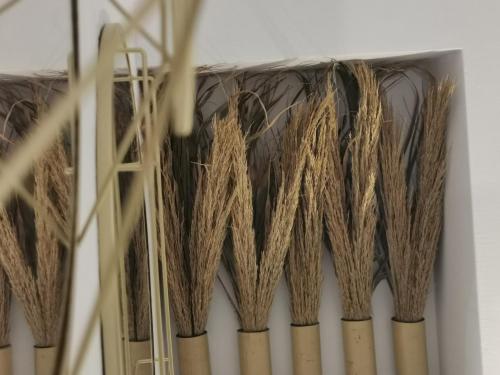 a bunch of bamboo poles in a room at Alexandra's Home in Fira