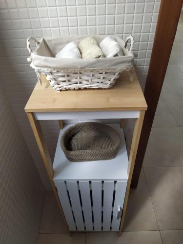 a basket of towels on a table in a bathroom at Casa Maria Cotillo Mar in El Cotillo