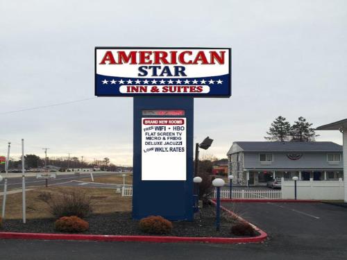 a sign for an american star inn and suites at American Star Inn & Suites Atlantic City in Galloway