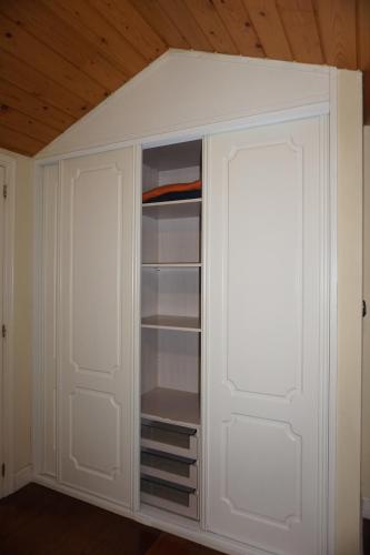 a closet with white cabinets and a ceiling at Mundaka Vista Mar L-BI-52 in Mundaka