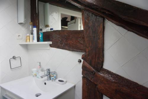 a bathroom with a sink and a mirror at ATICO TORRONTERO in Mundaka