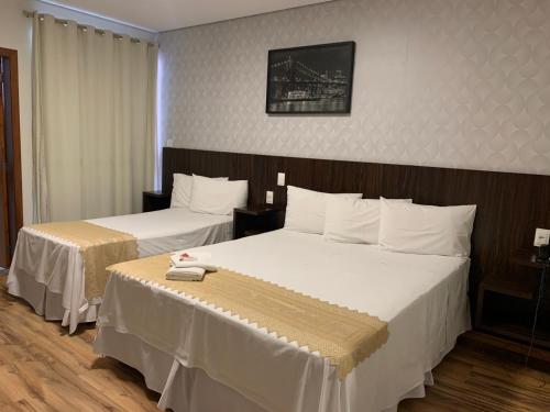 Cama ou camas em um quarto em Splendore Hotel