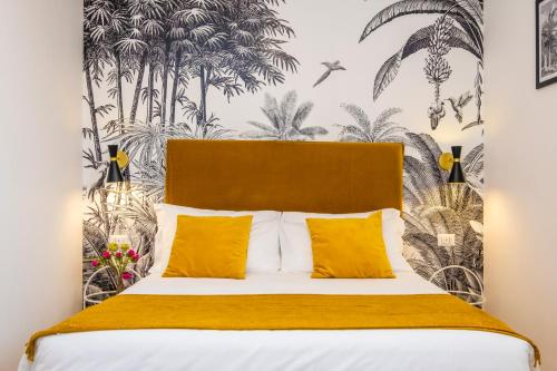 a bedroom with a large bed with yellow pillows at The Vista Rooms & Terrace in Rome