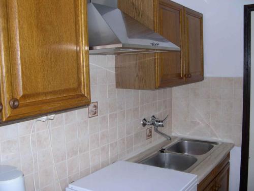 a kitchen with a sink and aaucet at Holiday home in Balatonkeresztur 19234 in Balatonkeresztúr