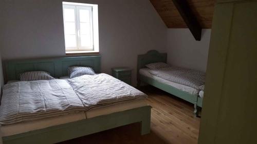 a bedroom with two beds and a window at Holiday home in Horni Marsov 30398 in Horní Maršov