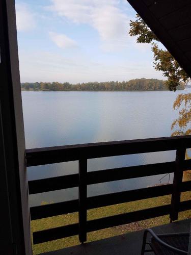 a view of a lake from a porch at Holiday home in Hluboka nad Vltavou 26850 in Hluboká nad Vltavou