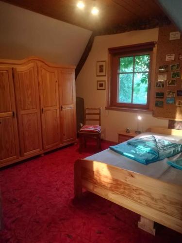 a bedroom with a large bed and a window at Holiday home in Trebbin 2611 in Trebbin
