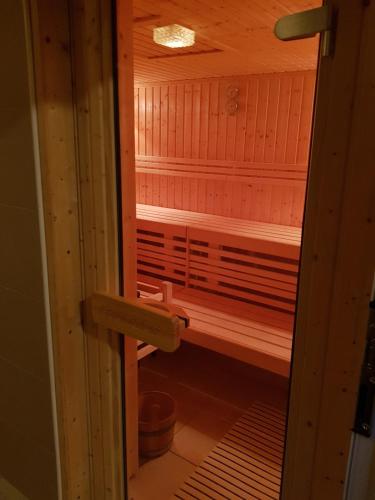 a sauna is shown through a wooden door at Berghotel Natura Bed & Breakfast in Winterberg
