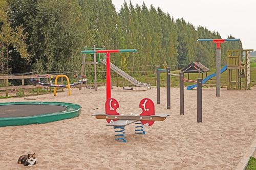 a group of playground equipment in the sand at Christinahoeve Hooiberg #5 in Boskoop