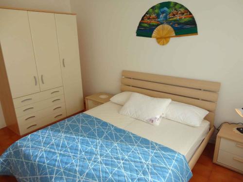 Letto o letti in una camera di Apartment in Porto Santa Margherita 25145