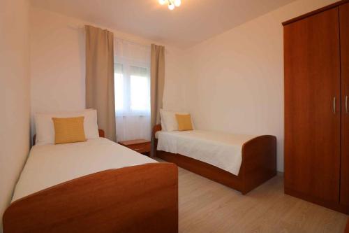 Postel nebo postele na pokoji v ubytování Holiday Homes in Porec - Istrien 10234