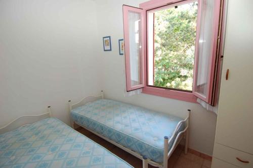 Posteľ alebo postele v izbe v ubytovaní Apartment in Rosolina Mare 24888