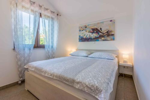 Postel nebo postele na pokoji v ubytování Apartment in Crikvenica 34970