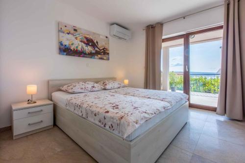 Posteľ alebo postele v izbe v ubytovaní Apartment in Crikvenica 34973