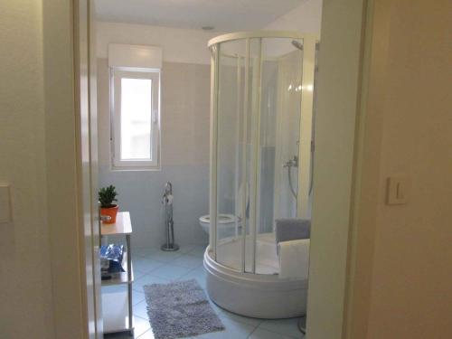 a bathroom with a shower and a toilet at Holiday home in Grizane 5170 in Grižane