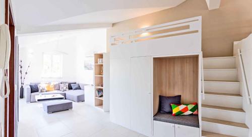 a loft bed in a room with a living room at Apartment in Vantacici/Insel Krk 13135 in Vantačići