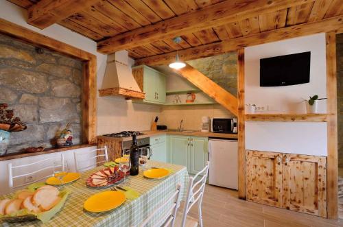 a kitchen with a table with food on it at Holiday home in Buzet - Istrien 27727 in Buzet