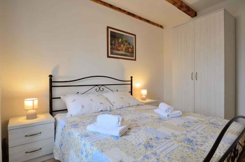 a bedroom with a bed with two towels on it at Holiday home in Buzet - Istrien 27727 in Buzet