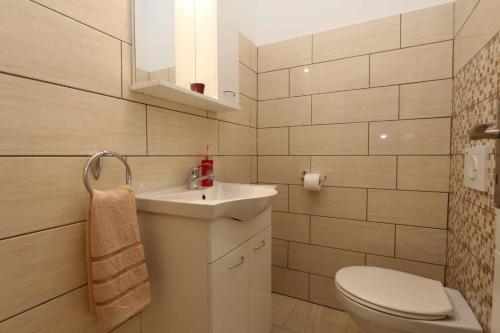 a bathroom with a sink and a toilet at Apartments in Silo/Insel Krk 26753 in Šilo