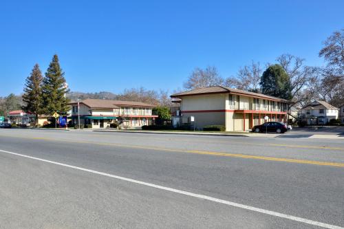 an empty street in a small town with houses at Atascadero Inn in Atascadero