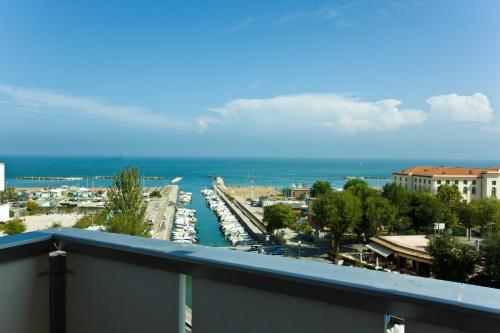 a view of a harbor from a balcony at Waldorf Palace Hotel in Cattolica