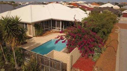an aerial view of a house with a swimming pool at Halls Head Holiday Home in Mandurah