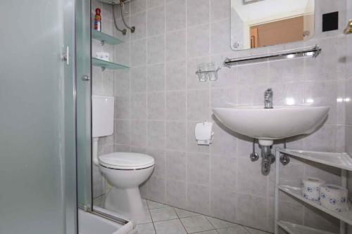 a bathroom with a toilet and a sink at Holiday home in Silo/Insel Krk 26695 in Šilo