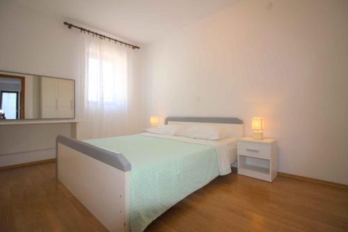 Ένα ή περισσότερα κρεβάτια σε δωμάτιο στο Holiday home in Porec - Istrien 9919