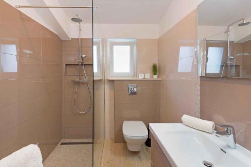 a bathroom with a shower and a toilet and a sink at Apartment in Rabac 16817 in Rabac