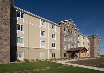 a large building with a gazebo in front of it at MainStay Suites Rapid City in Rapid City