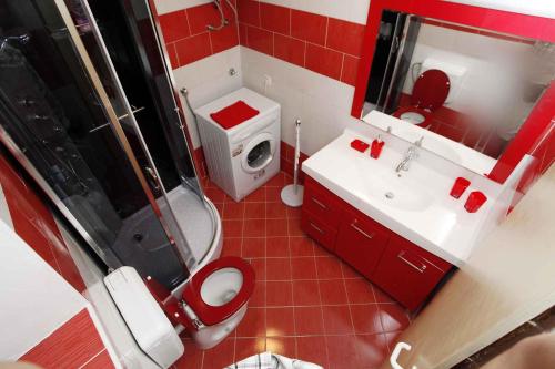 a bathroom with a toilet and a shower and a sink at Holiday home in Pomer/Istrien 9026 in Pomer