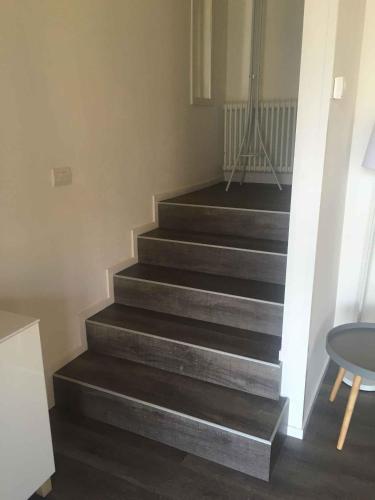 a set of stairs in a room with a table at Apartments in Pur - Ledrosee 22640 in Pur
