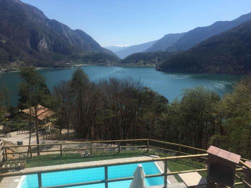 a swimming pool with a view of a lake at Apartments in Pur - Ledrosee 22640 in Pur