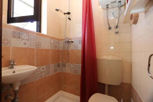 a bathroom with a toilet and a sink and a shower at Studio in Silo/Insel Krk 14757 in Šilo