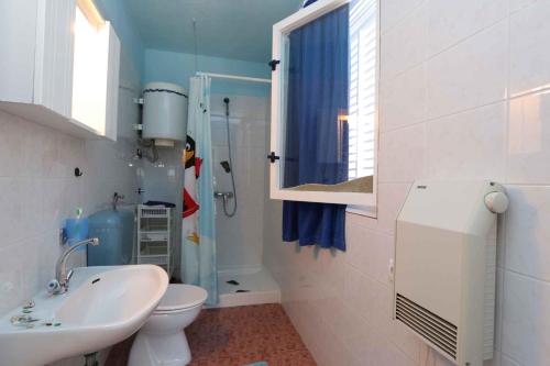 a bathroom with a sink and a toilet and a shower at Studio in Silo/Insel Krk 13449 in Šilo