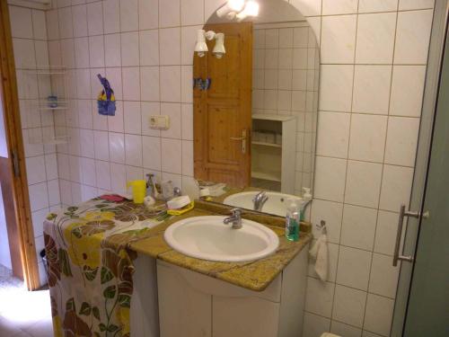 a bathroom with a sink and a mirror at Apartment Balatonbereny 1 in Balatonberény