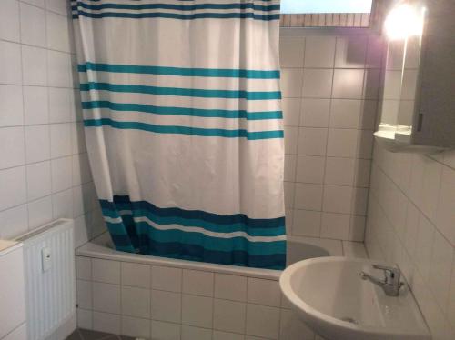 a bathroom with a shower curtain and a sink at Apartment in Fulpmes/Tirol 711 in Fulpmes