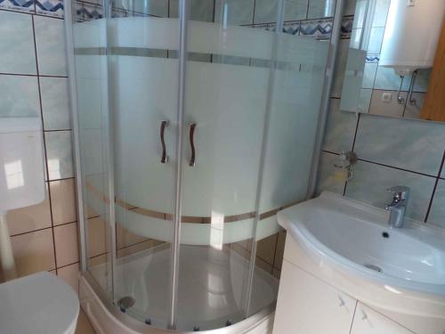 a shower in a bathroom with a toilet and a sink at Apartment Crikvenica, Vinodol 8 in Crikvenica