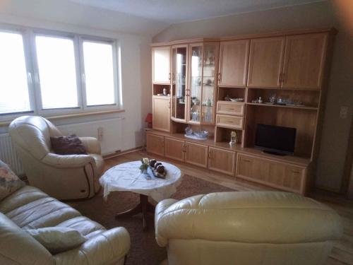 a living room with a couch and a coffee table at Apartment Gingst 1 in Gingst