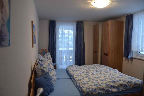 a bedroom with a bed in front of a window at Apartment Todtmoos 4 in Vordertodtmoos