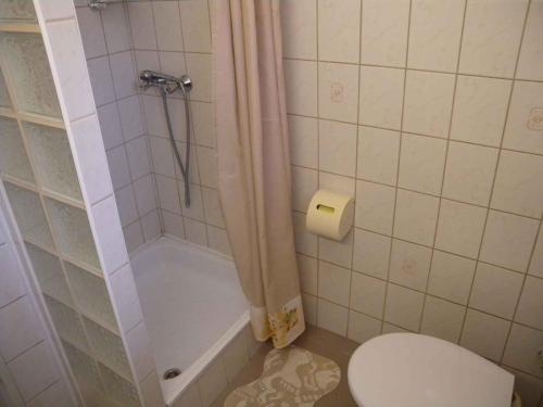 a white bathroom with a toilet and a shower at Apartment in Zalakaros - Thermalbad 20682 in Zalakaros