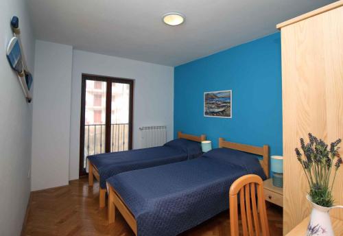 Posteľ alebo postele v izbe v ubytovaní Apartments in Rabac 16693