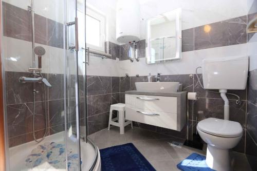 a bathroom with a shower and a toilet and a sink at Apartment in Silo/Insel Krk 13416 in Šilo